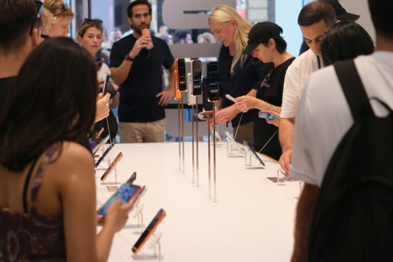People looking at new iPhones
